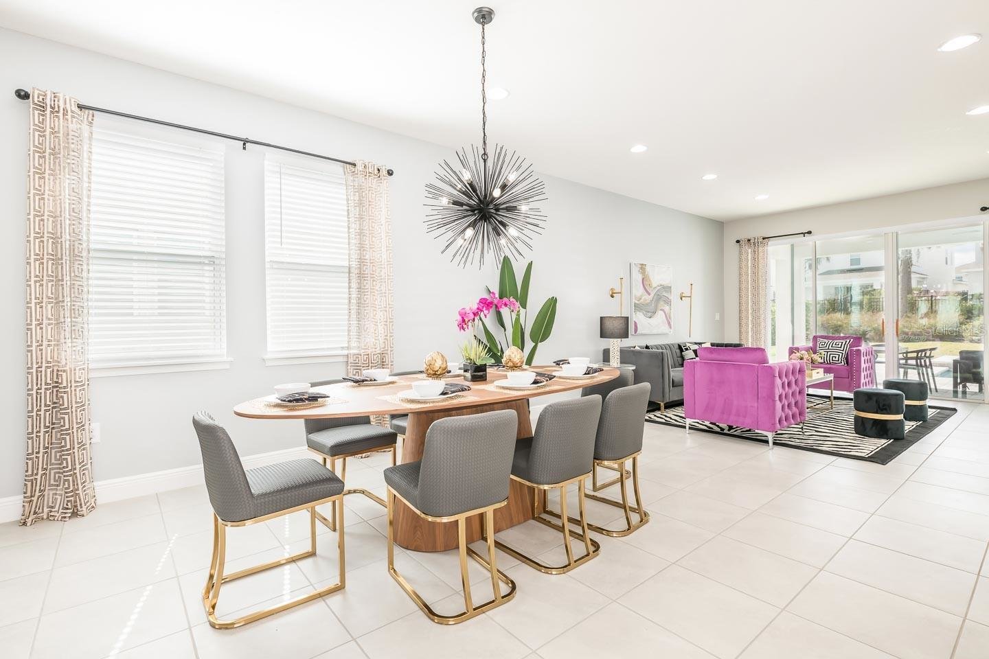 modern dining room with gold and pink accents